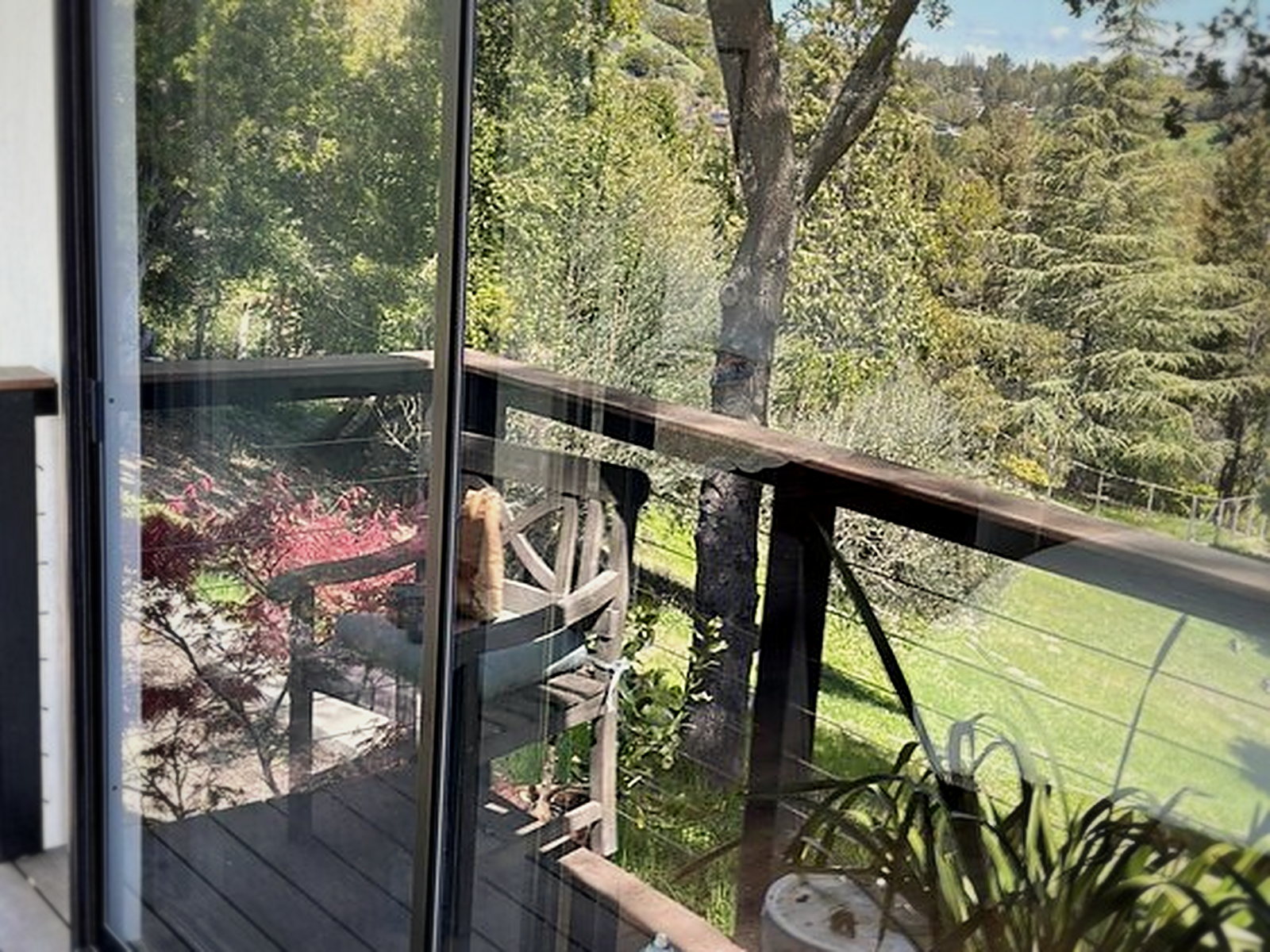 Secondary soundproof sliding glass door installed on the exterior with the original sliding door visible inside