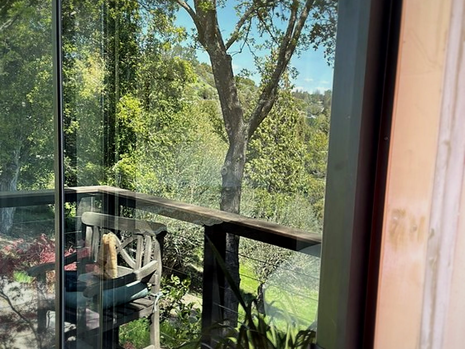 Build-out framing around a new black sliding glass door unit in an Orinda home, viewed from the deck