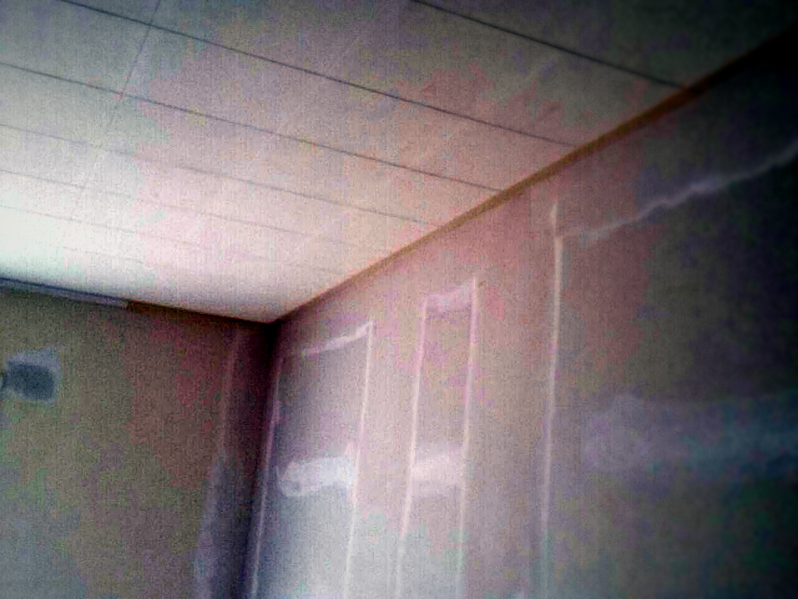 Finished taped and painted classroom wall and ceiling at Bridges Academy after soundproofing