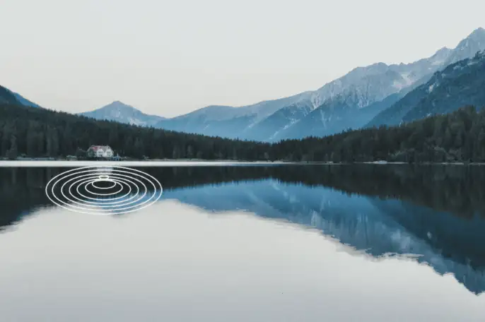 Concentric sound ripples radiating across a still mountain lake — how soundproofing controls noise transmission