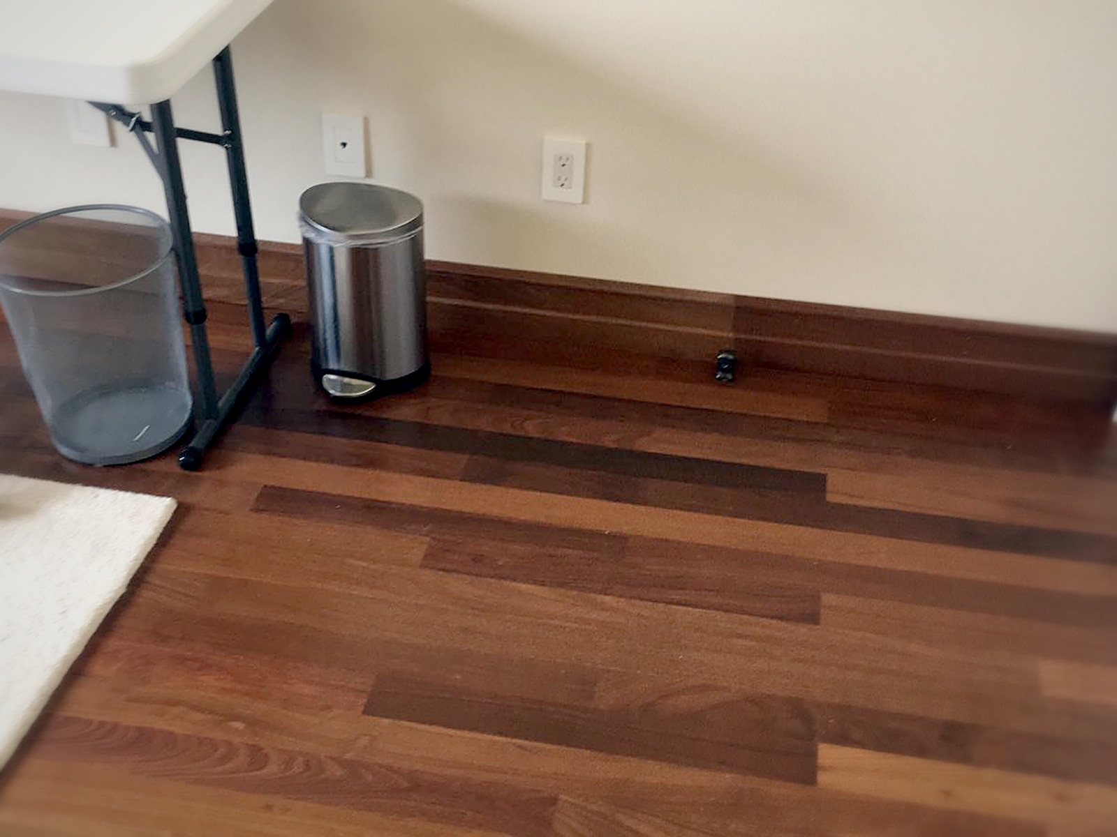 Finished hardwood flooring and painted wall in a completed Melrose residential soundproofing project
