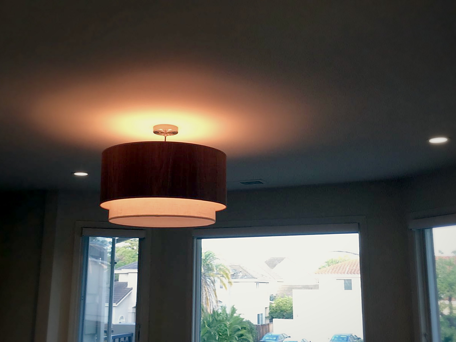 Finished soundproofed residential ceiling in Melrose with a flush pendant fixture and recessed downlights