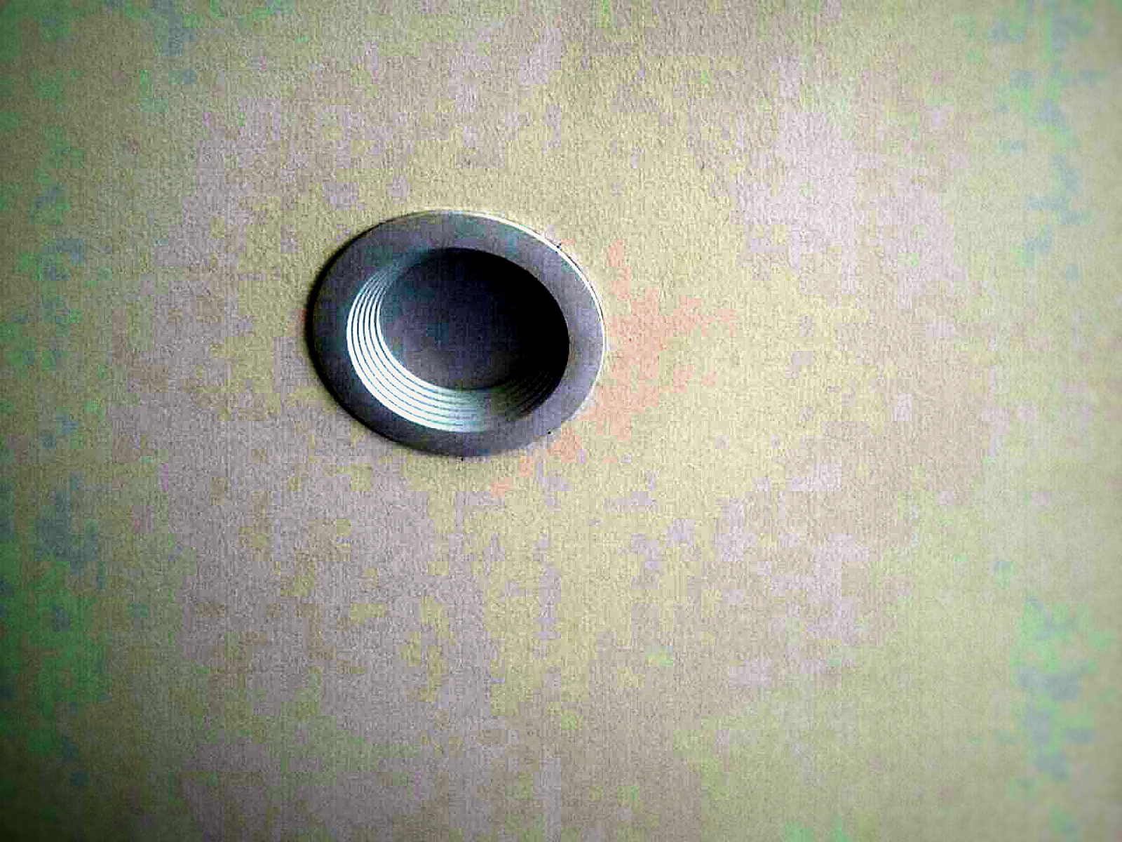 Finished painted classroom ceiling with a flush recessed downlight after soundproofing