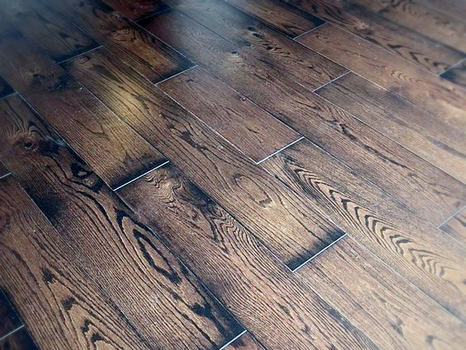 Floated hardwood flooring running cleanly through a doorway and closet threshold after soundproofing work