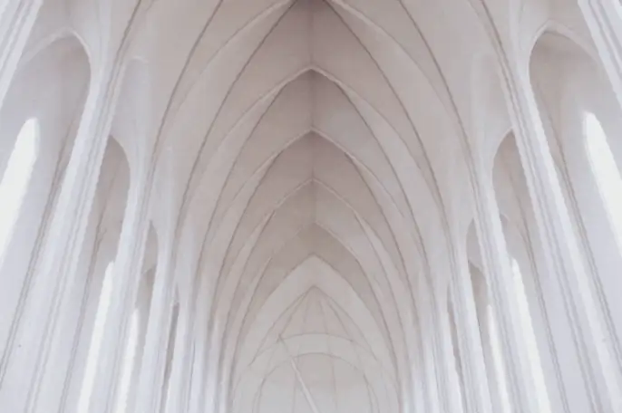 Vaulted white cathedral ceiling arches — measuring sound with dB, STC, and IIC ratings